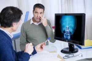 Man speaking with doctor about sinuses
